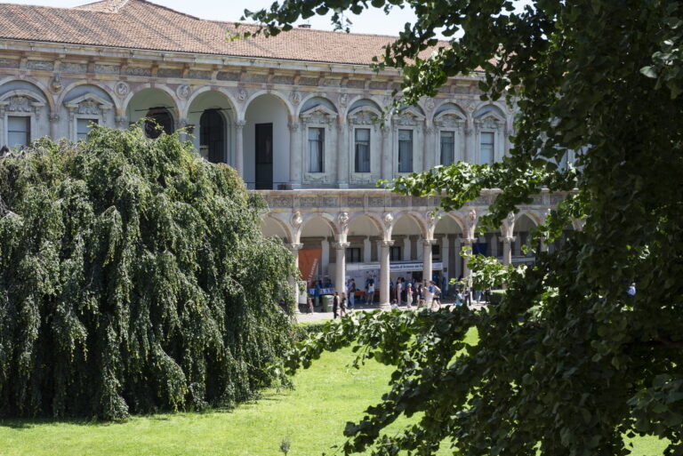 Detail of the Ca' Granda with portico and trees.